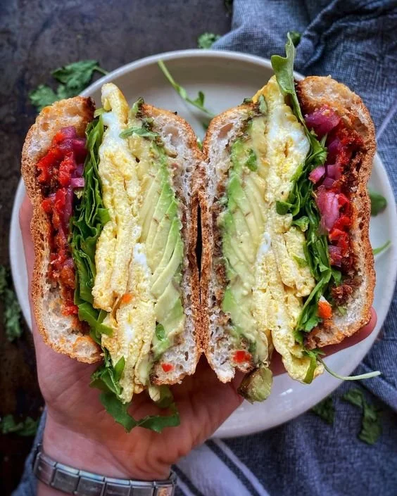 English Muffin Sandwich with Eggs, Kale, Avocado and Pickled Red Onions