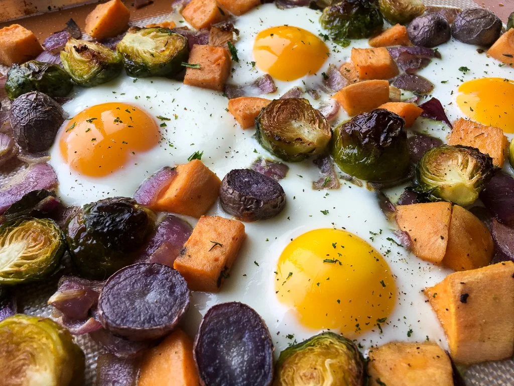 Mixed Blue and Sweet Potato Sheet Pan Hash with Eggs