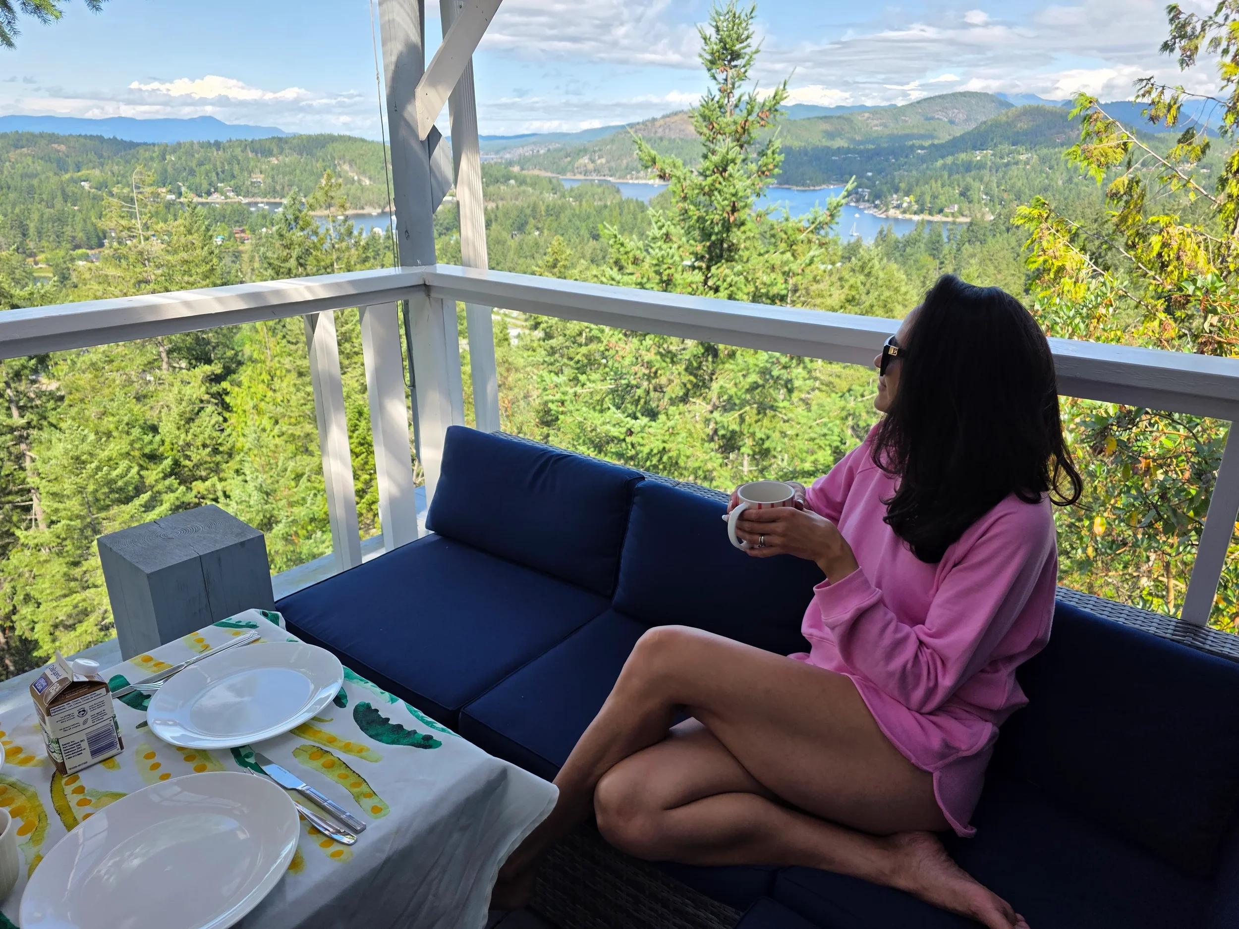 Woman drinking coffee and looking at beautiful view.