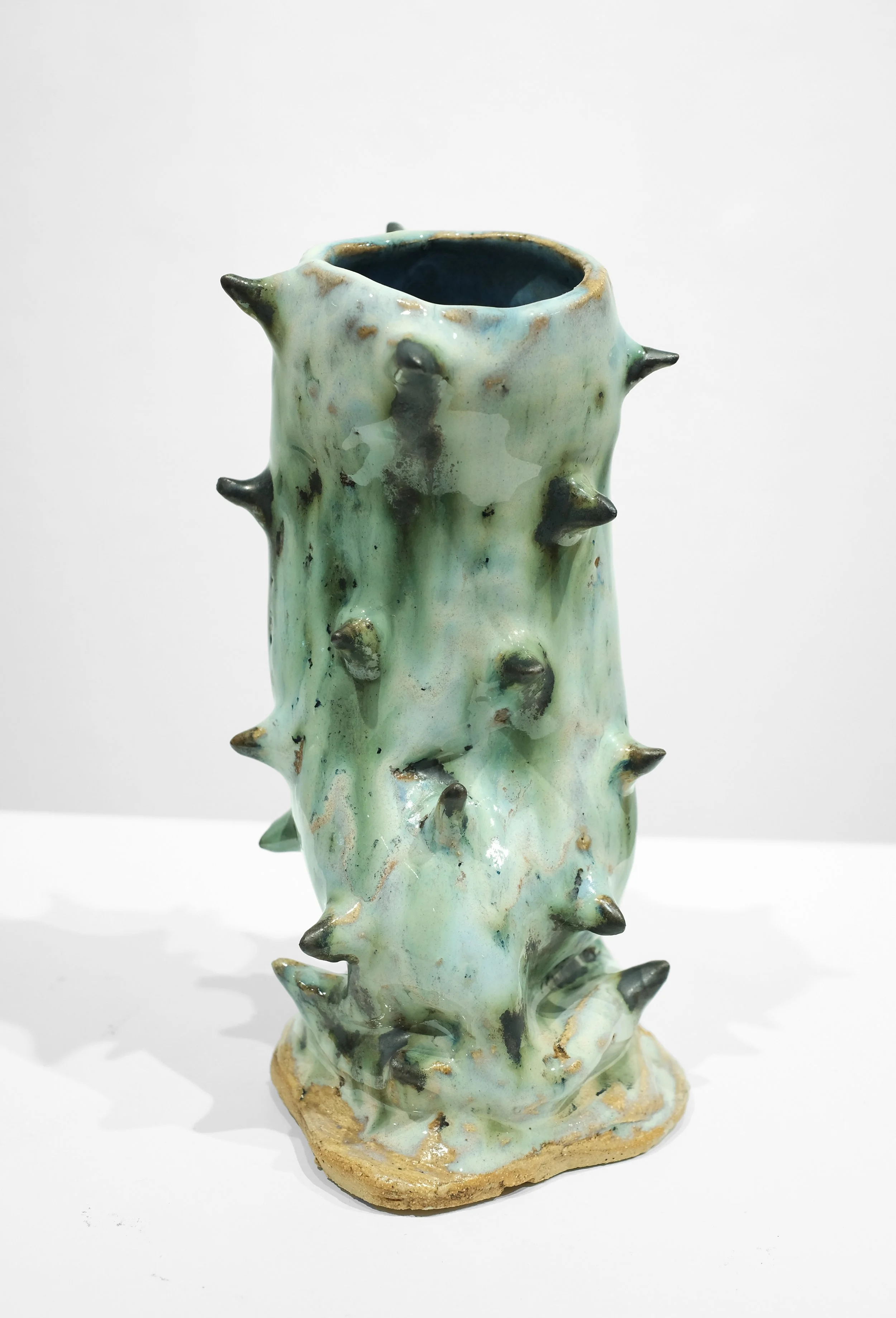 T1 stoneware, black slip and cream glaze, H: 8 x W: 5 x D: 2.5 Inches
