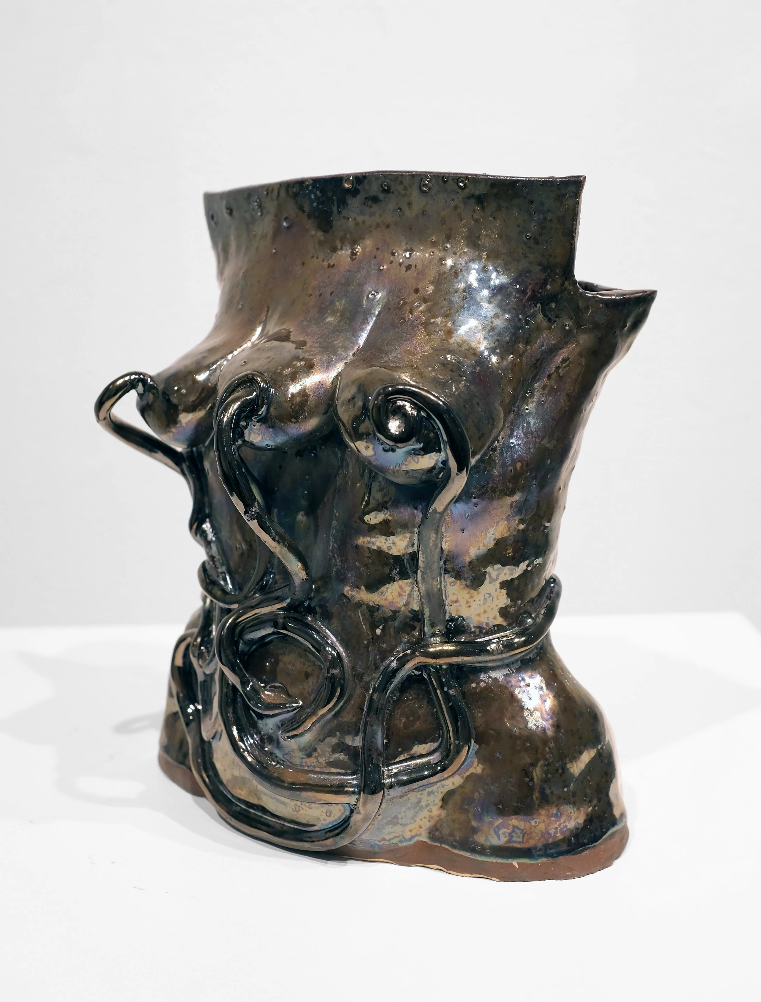 T1 Stoneware, metallic glaze, H: 8 x W: 7 x D: 5.5 Inches