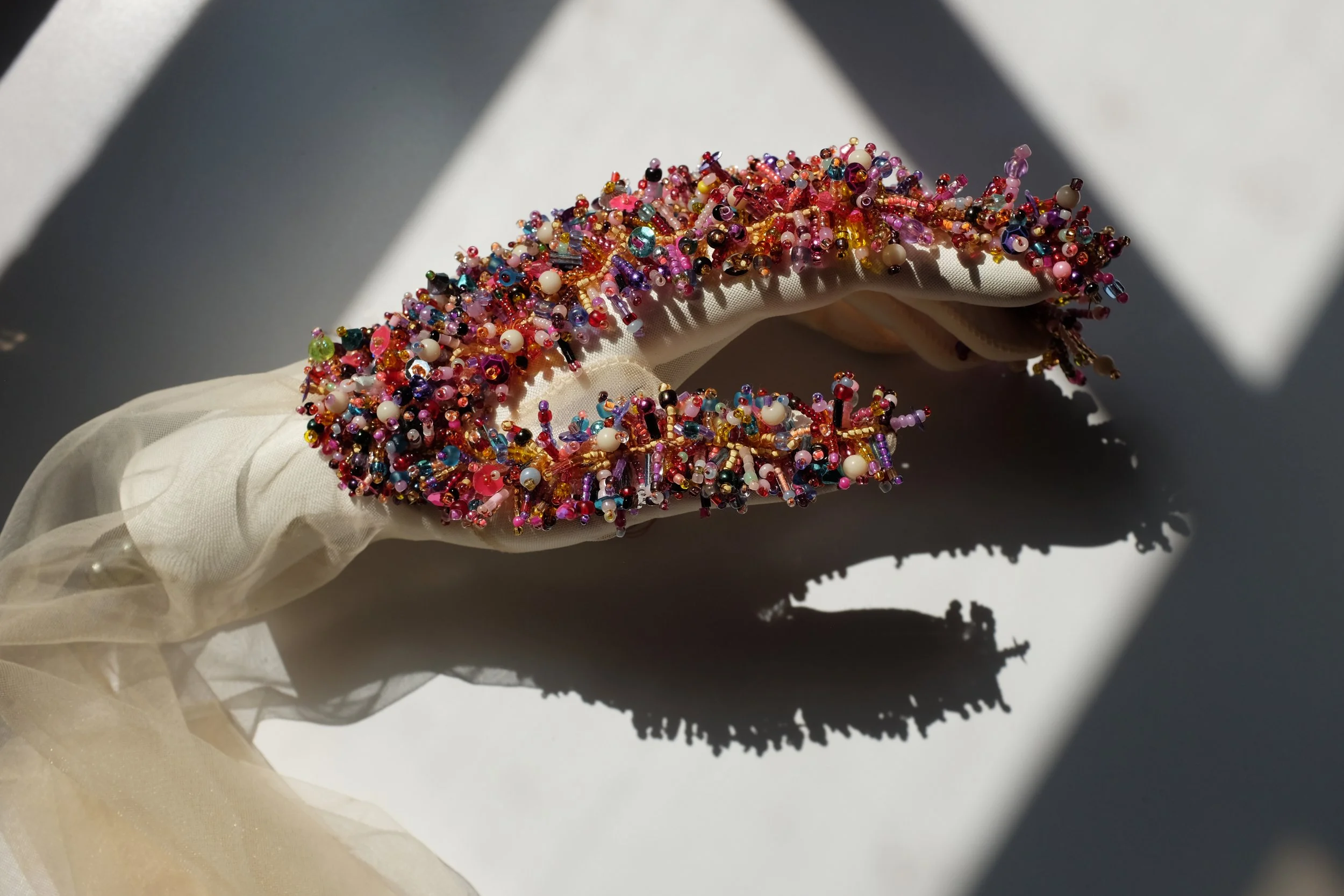 Spread, mannequin hand, flower petals, pantyhose, beads, H: 3.5" x W: 10" x D: 4", 2020