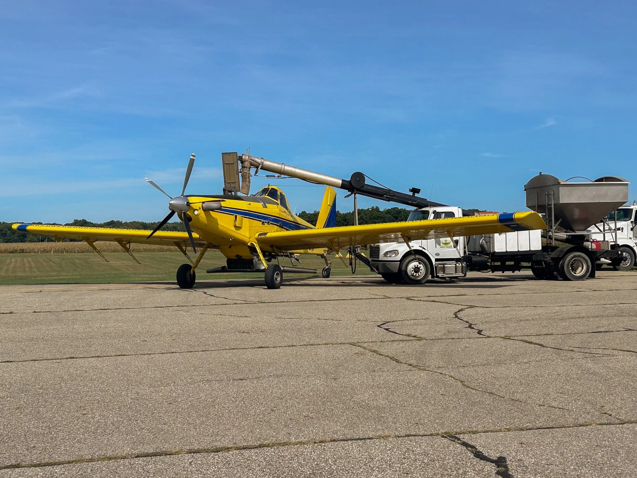 We're taking things to the skies! 
This crop duster is being loaded with cover crop seed that will be spread across our soybean fields before harvest begins. Seeding ahead of time gives the cover crop ample time to germinate and establish before the 