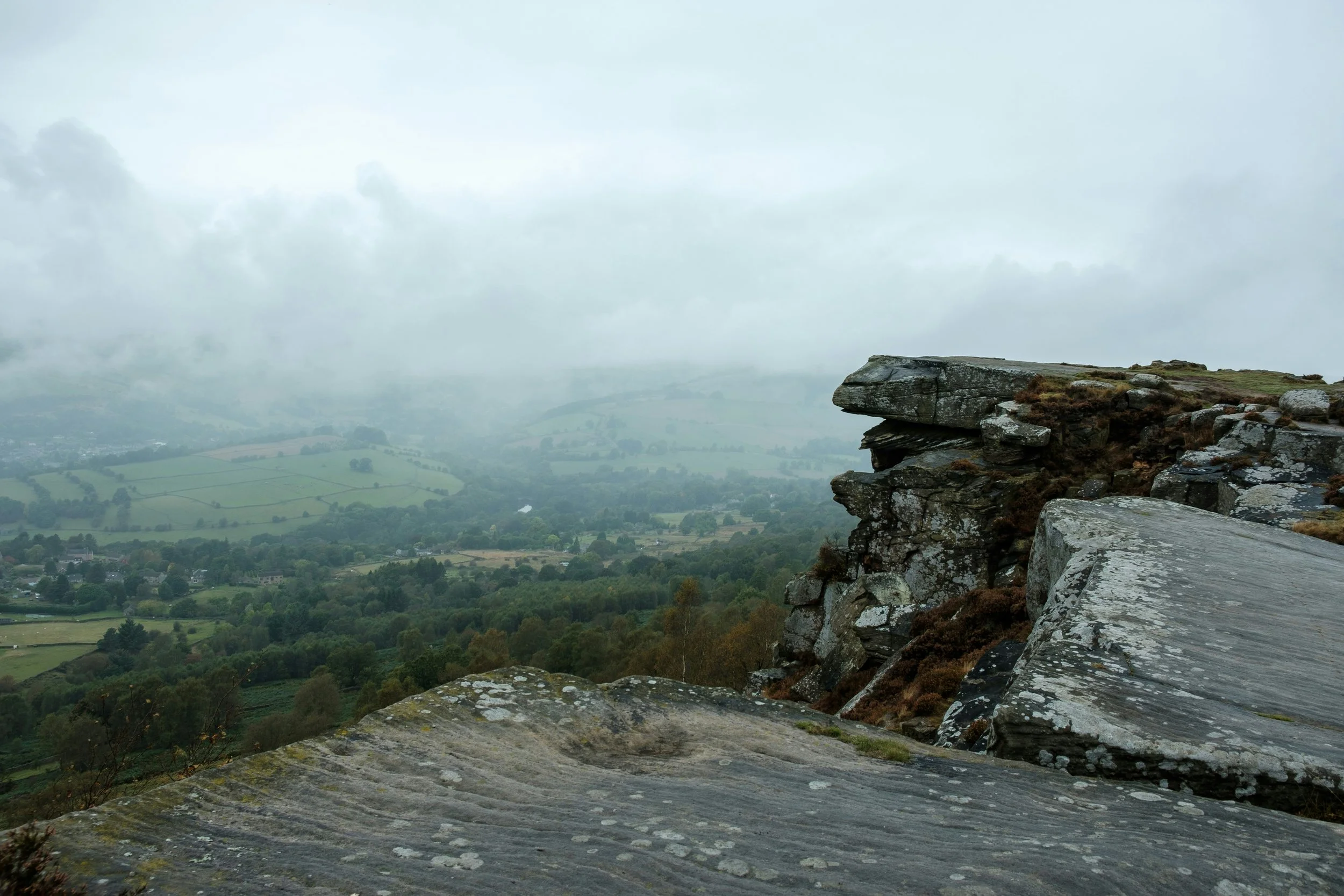 Cliffside imagery with fog on horizon