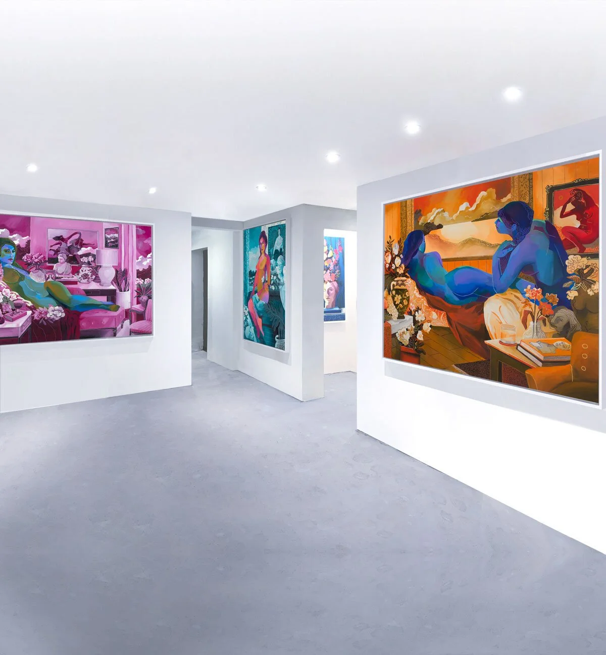 Interior view of an art gallery with colorful paintings on white walls and a polished concrete floor, bright lighting overhead.