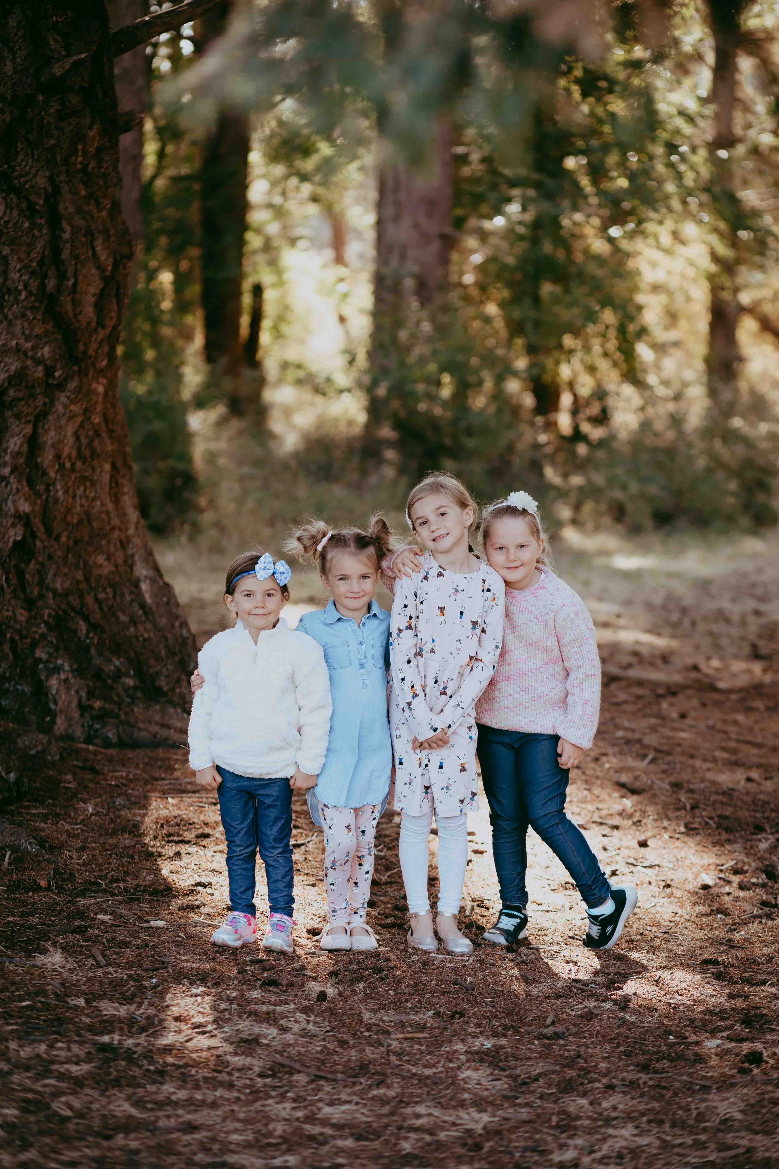a sweet posed family photo at Rathtrevor Provincial Park in Parksville