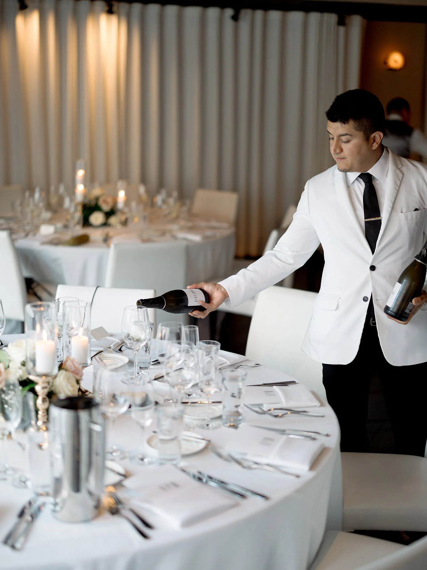 concierge pours wine at RPM Events for the wedding planner