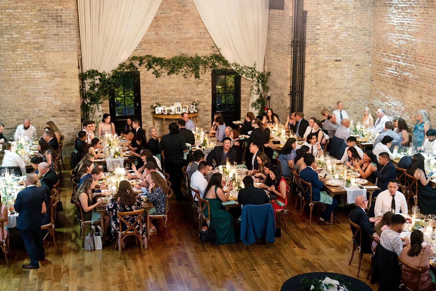 wedding guests eat dinner at The District in Richmond IL