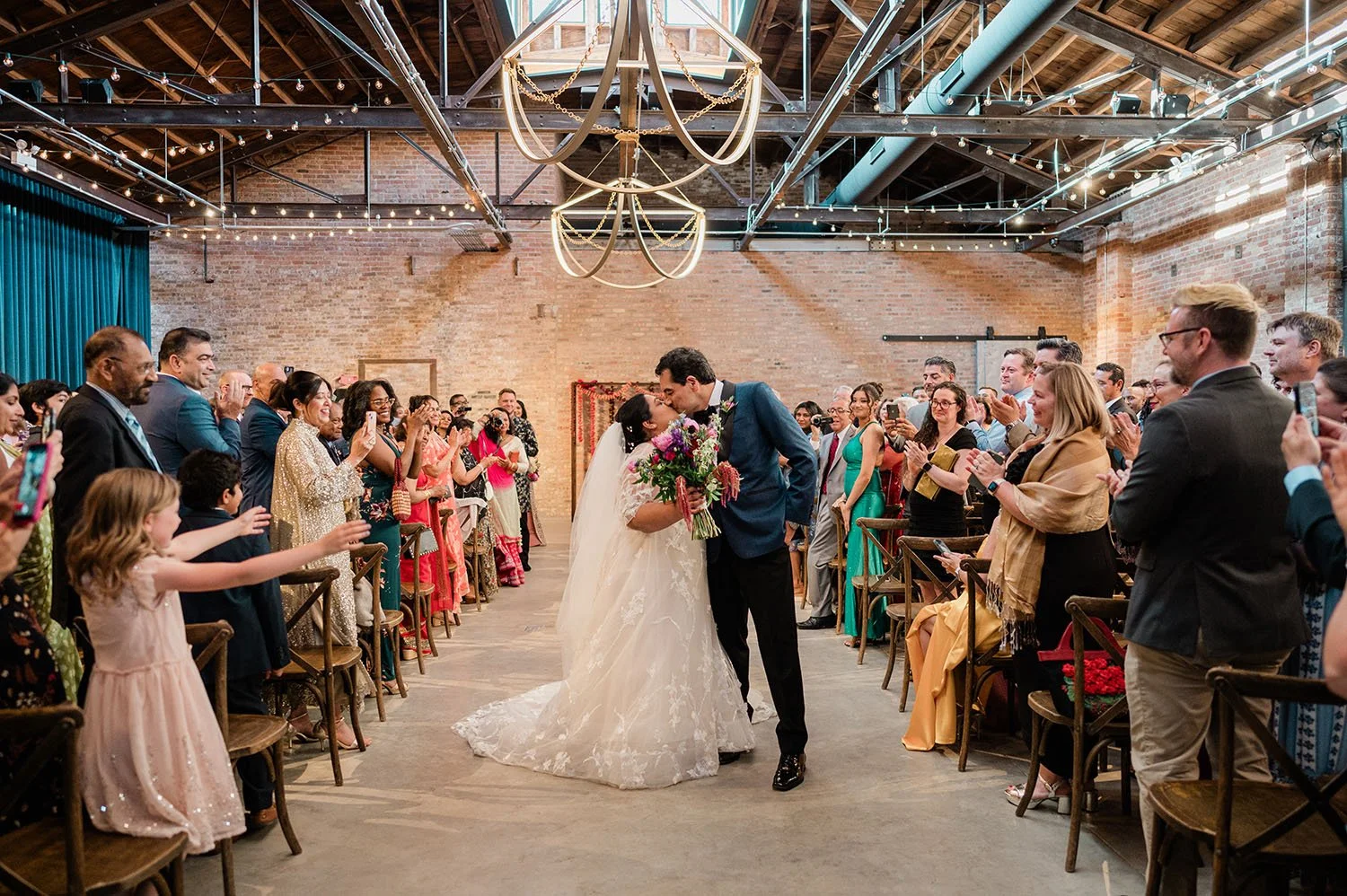 couple kisses at wedding ceremony at WildmanBT