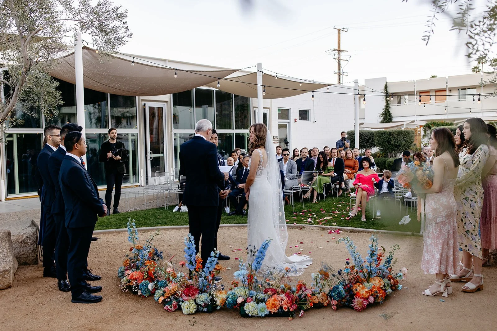 couple gets married at outdoor ceremony with ground florals