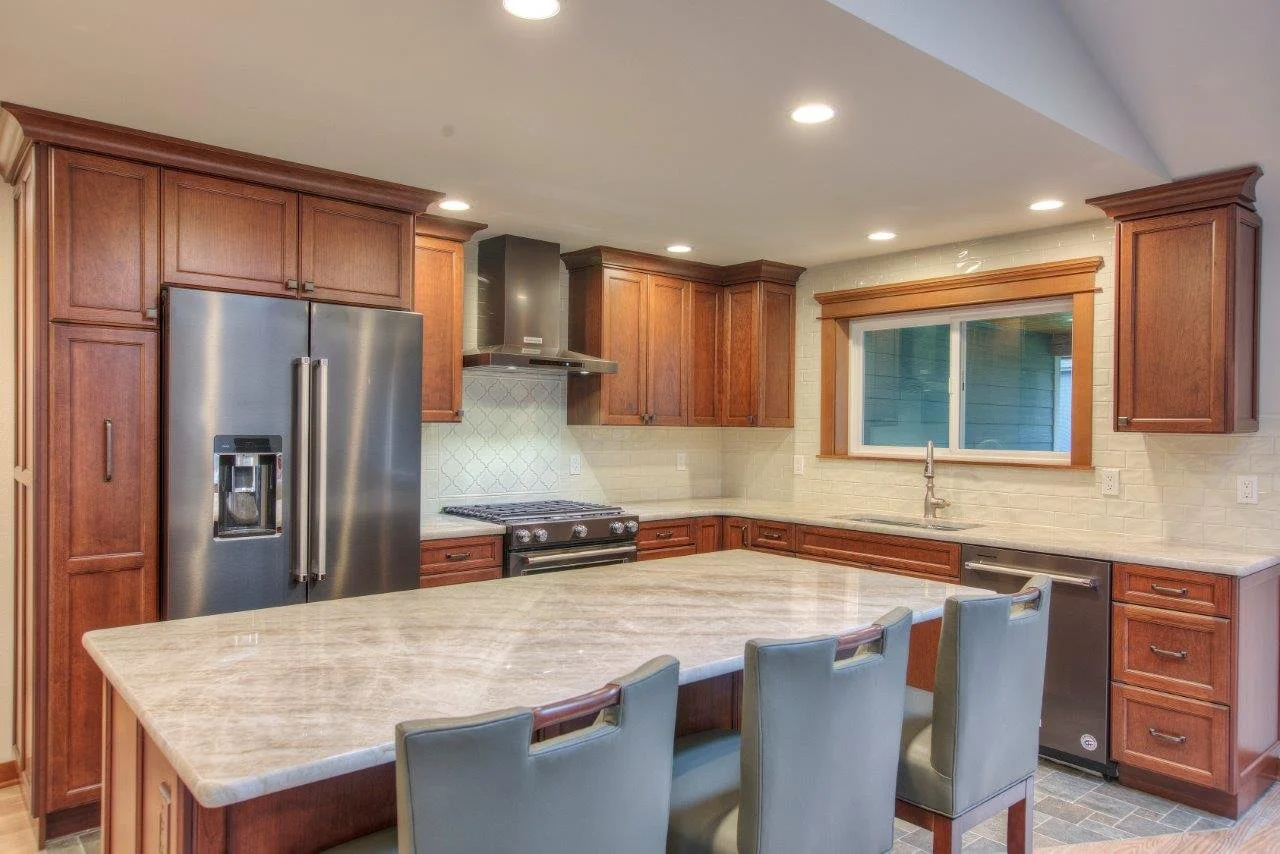 Luxury kitchen remodel in Gig Harbor with wood cabinets and stainless steel appliances.