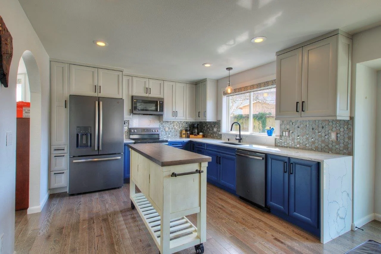 Design-build kitchen remodel showcasing stainless steel appliances and a center island in Tacoma.