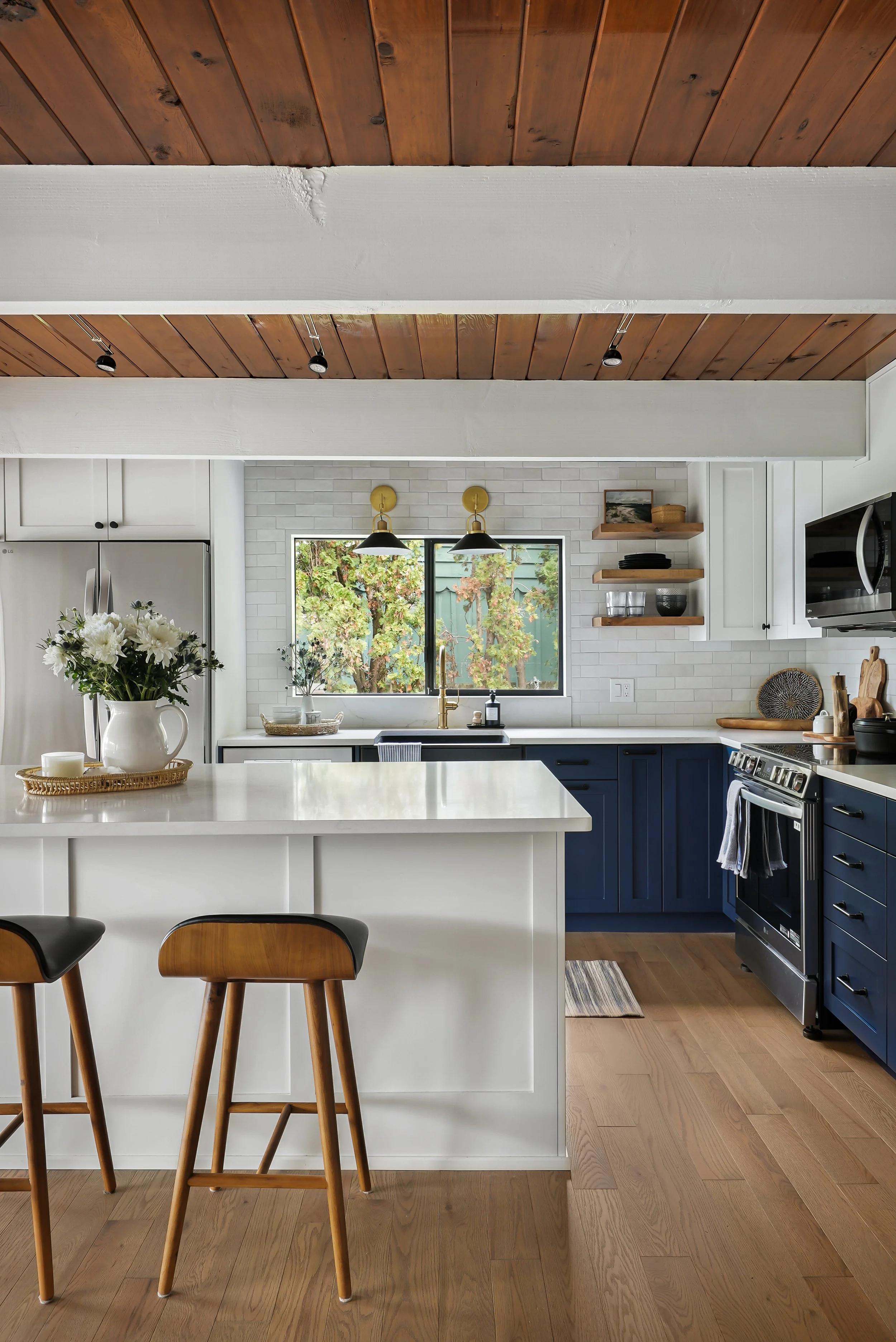 Overview of a beautiful beach house kitchen remodel featuring a large island in Gig Harbor.