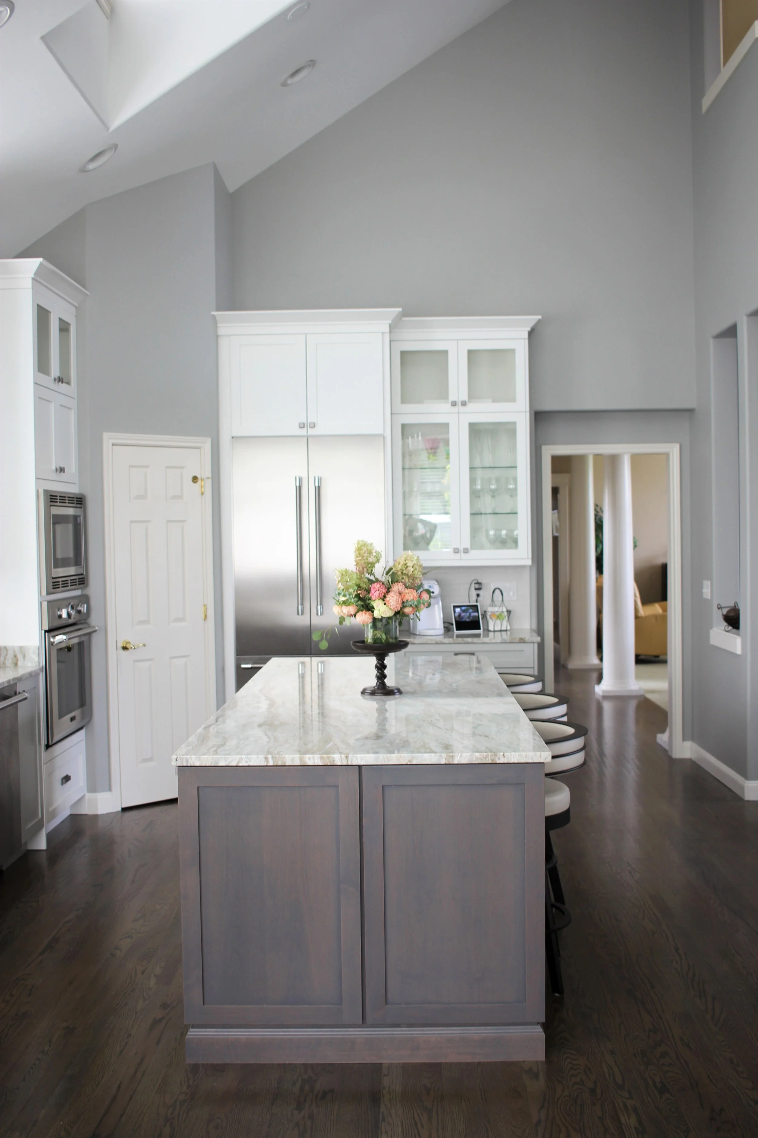 White shaker cabinets and a vaulted ceiling in a University Place kitchen remodel.