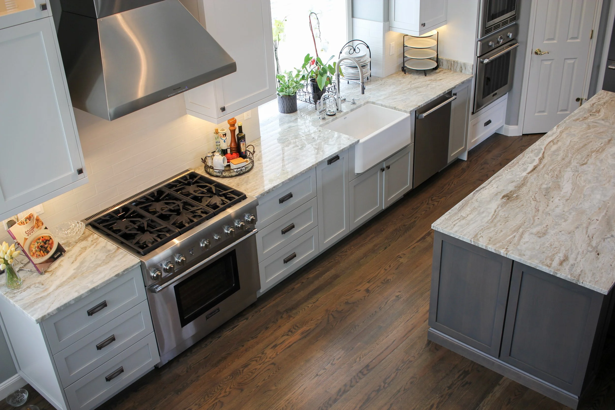 Luxury kitchen remodel featuring a built-in refrigerator and large island in Tacoma.