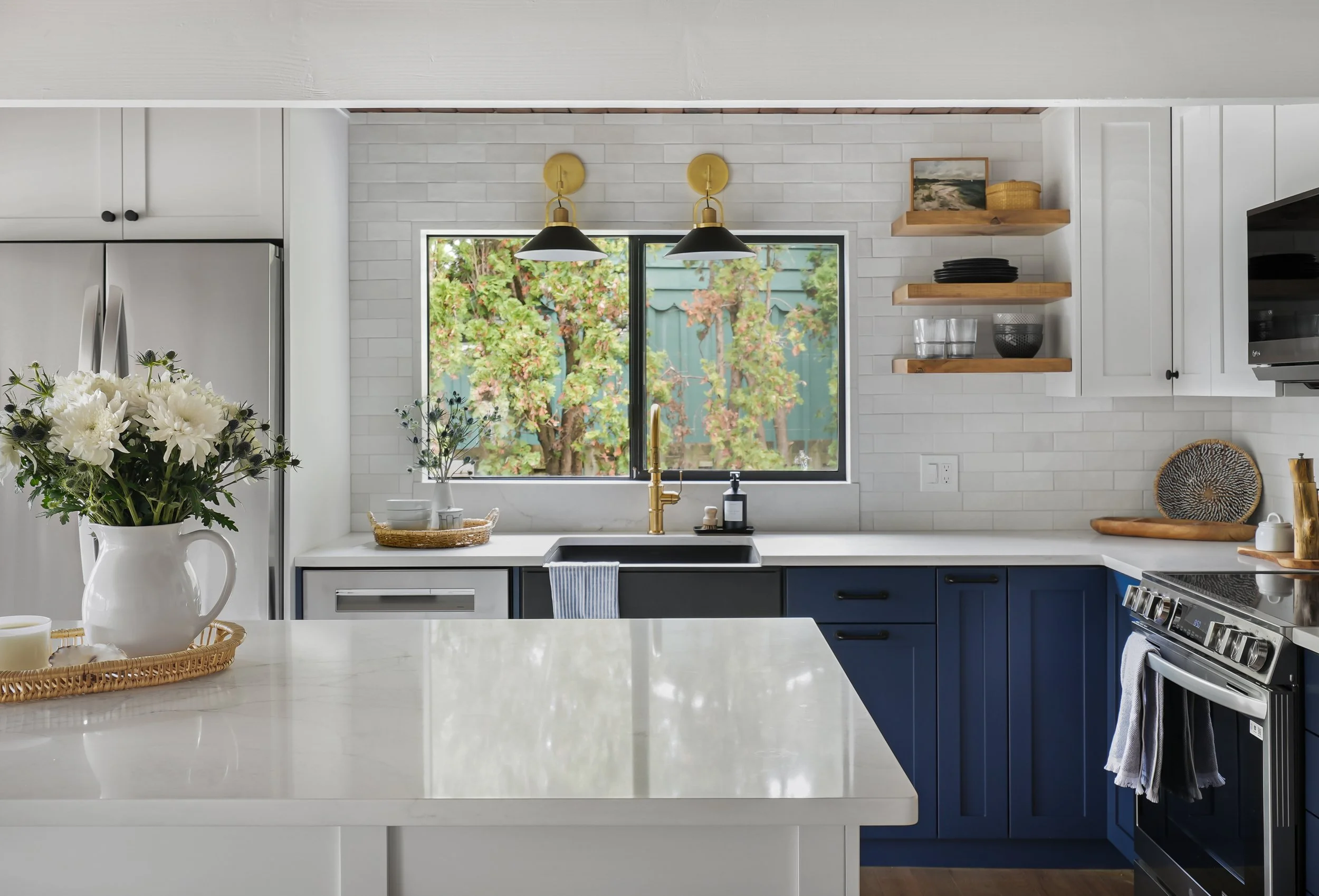 Custom wood open shelving and quartz countertops in a Tacoma kitchen remodeling project.