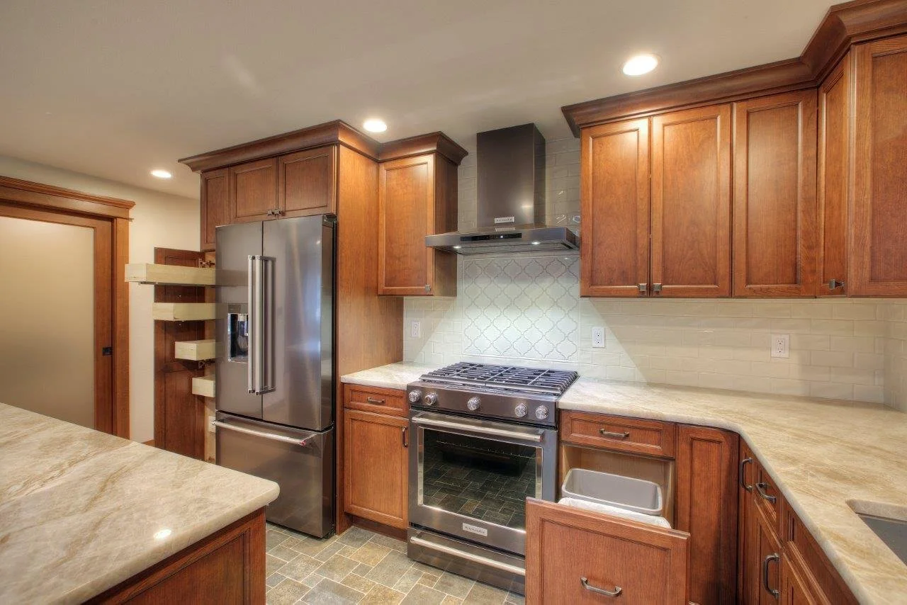 Custom wood pull-out cabinetry and drawers in a Gig Harbor luxury kitchen remodel.