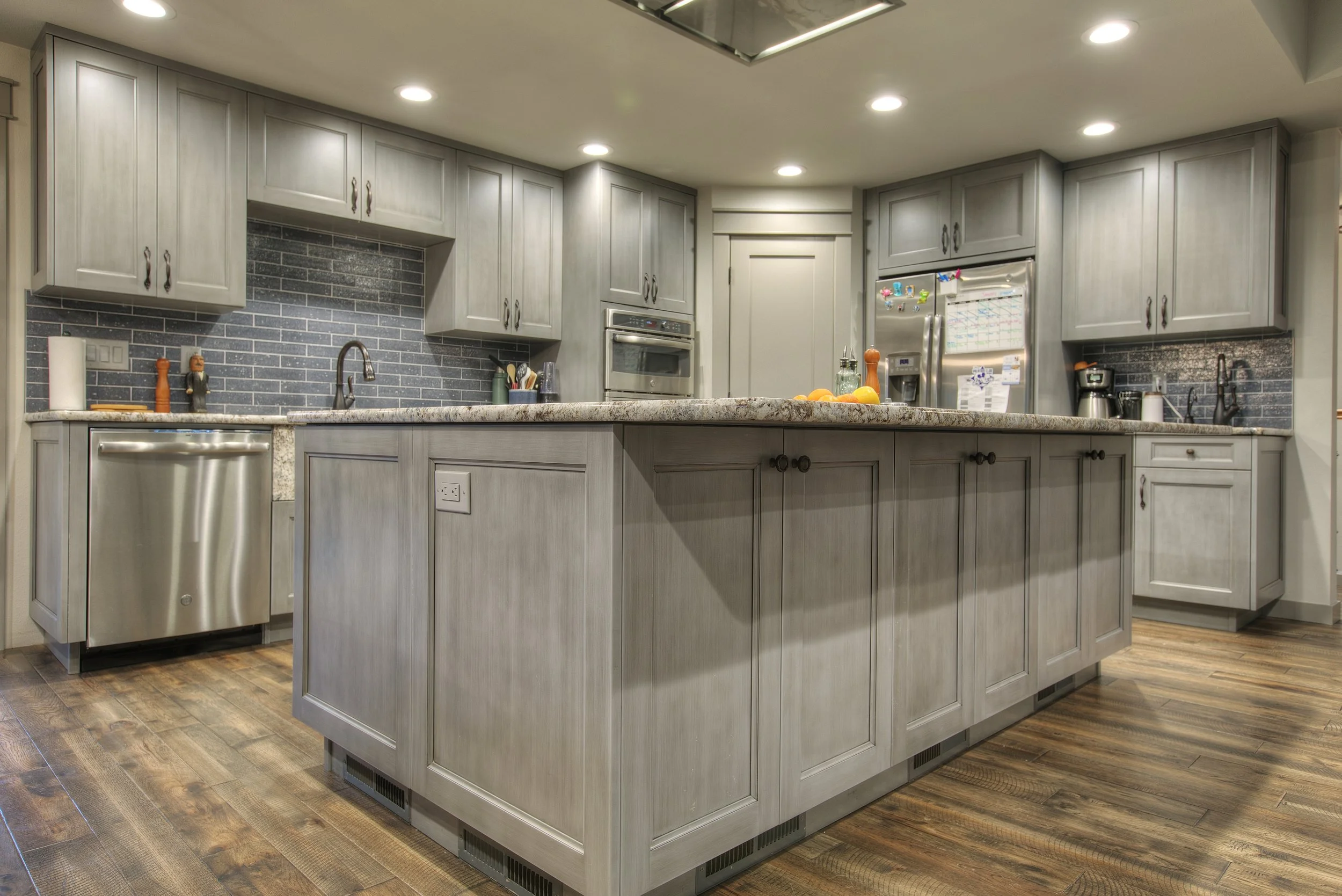 Craftsman-style kitchen remodel in Pierce County with a large wood island and skylights.