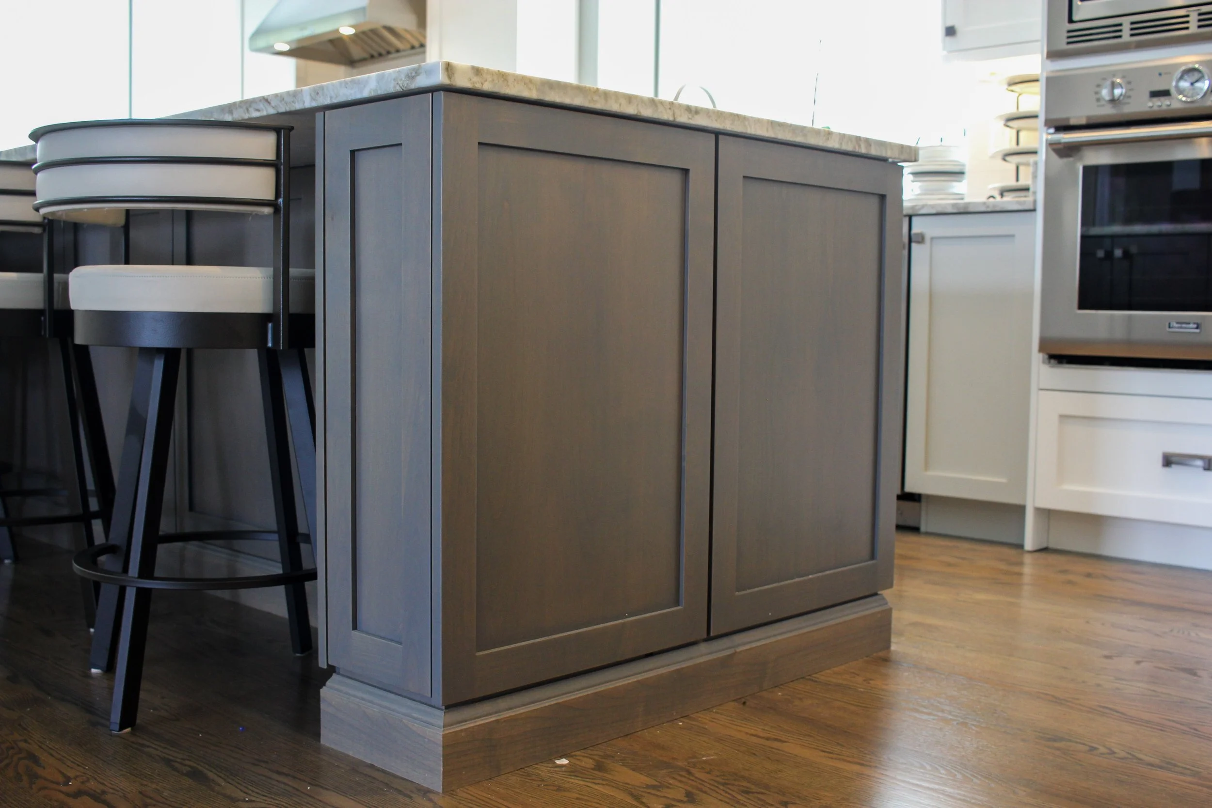 Detail of custom grey kitchen island cabinetry in a Gig Harbor home renovation.