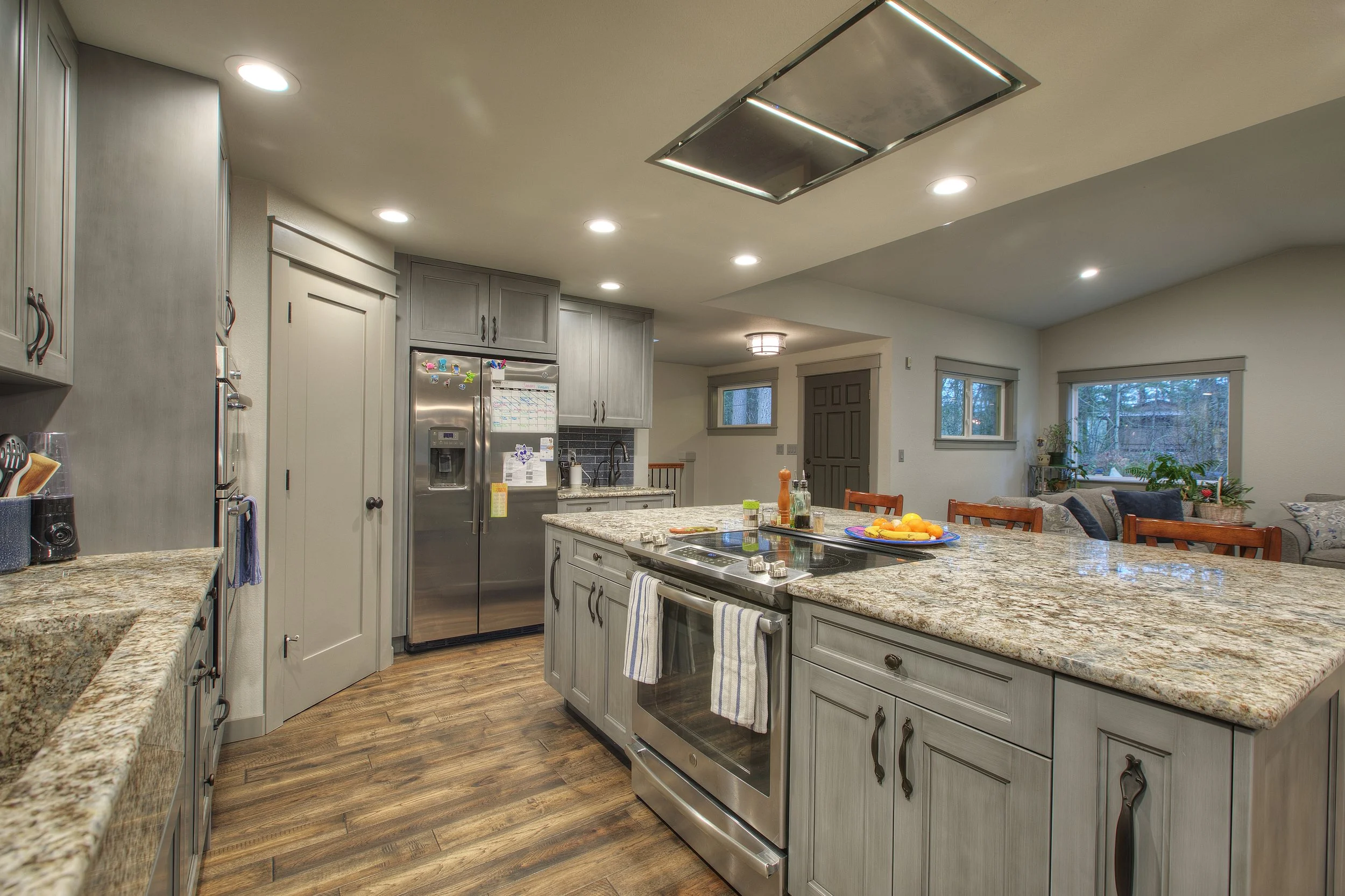 Luxury kitchen remodel in Gig Harbor with wood cabinets and stainless steel appliances.