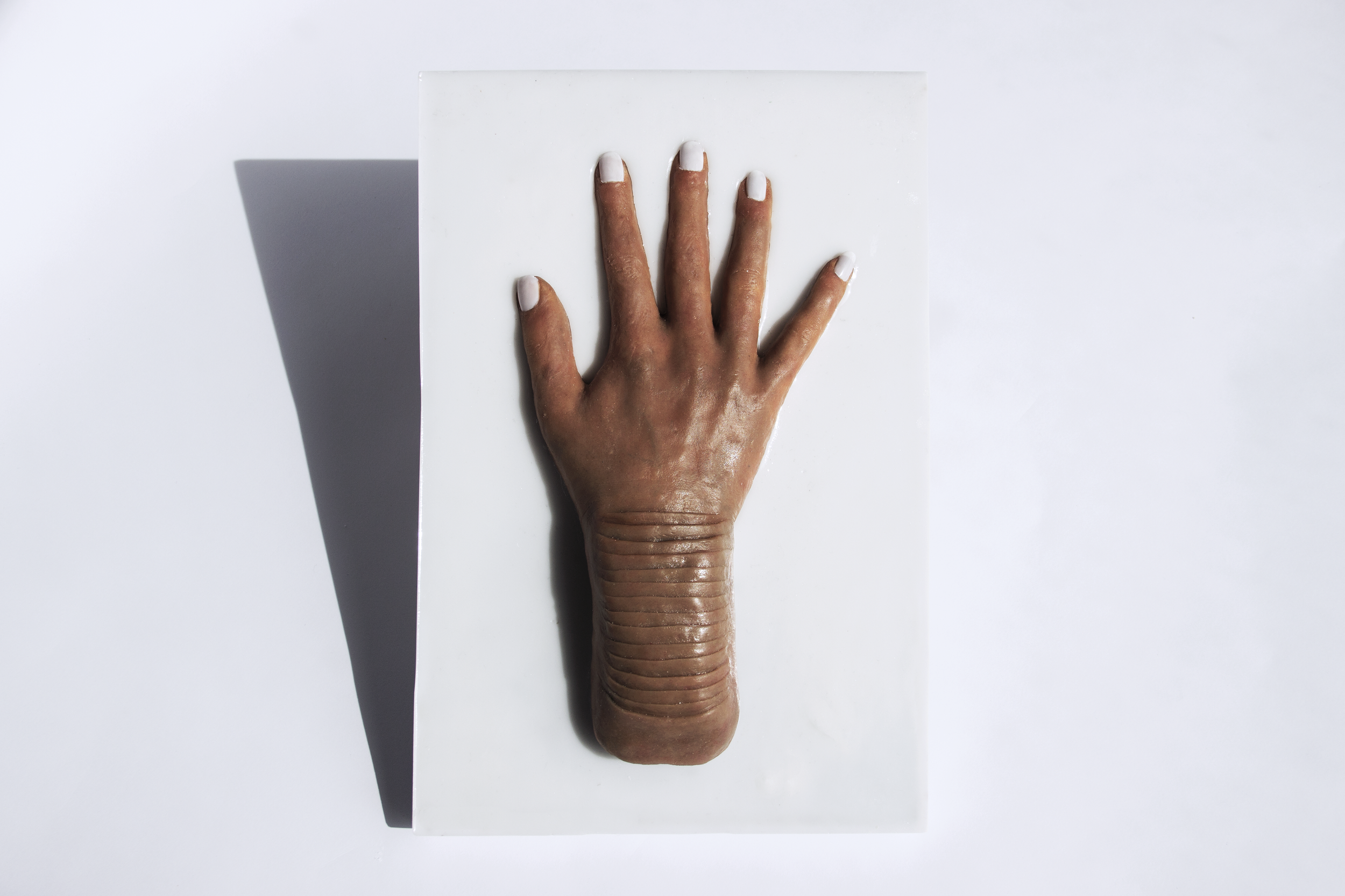 SETAE SKIN - From Speculative Design research TECHOSMETICS & THE SYNTHETIC SKIN SALON. A skin sample reproduction of engineerd SETAE SKIN on a hand.