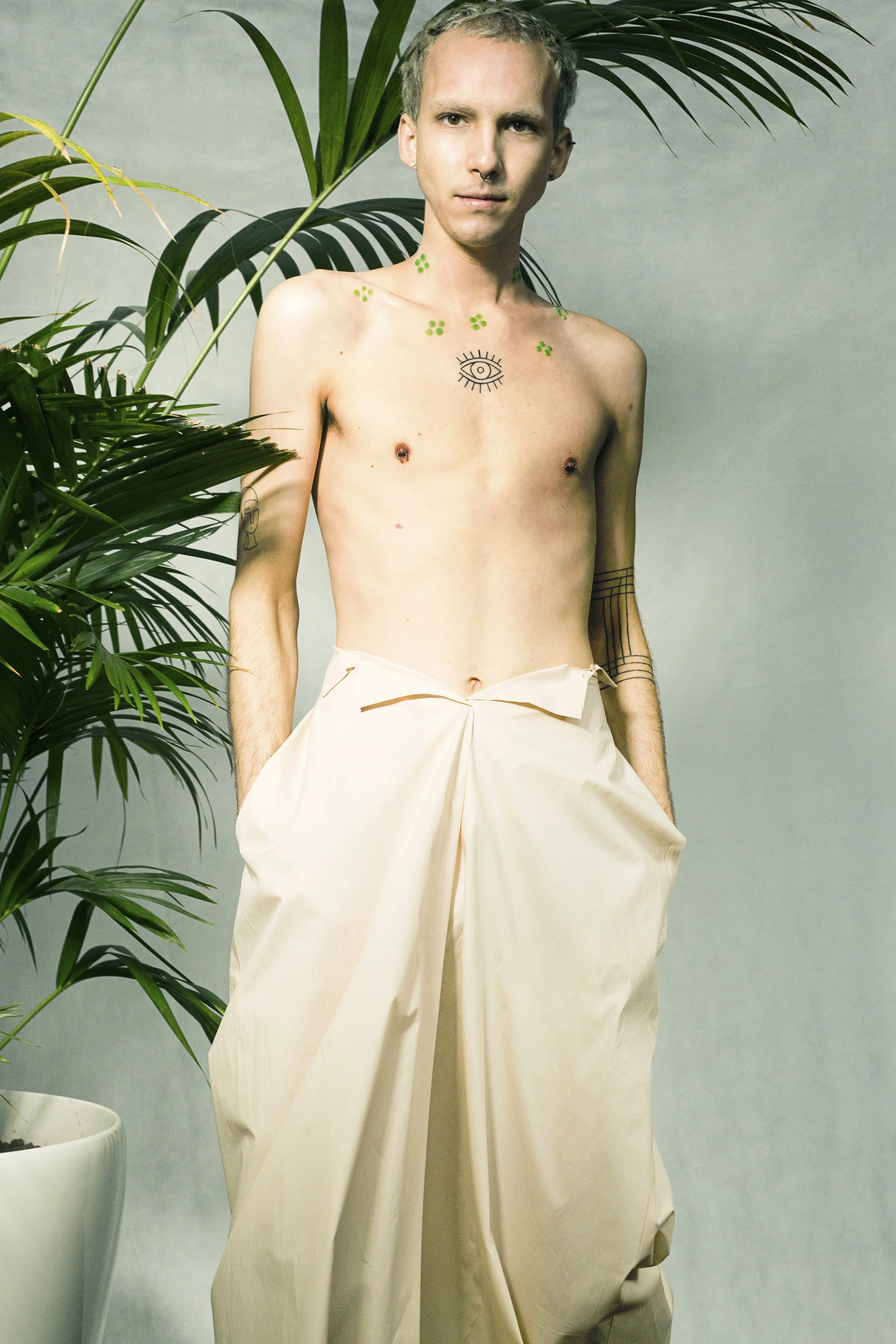 CHLOROPHYLL SKIN - From Speculative Design research TECHOSMETICS & THE SYNTHETIC SKIN SALON. A man with artificially engineered CHLOROPHYLL SKIN to absorb the sun as an alternative form of nutrition.