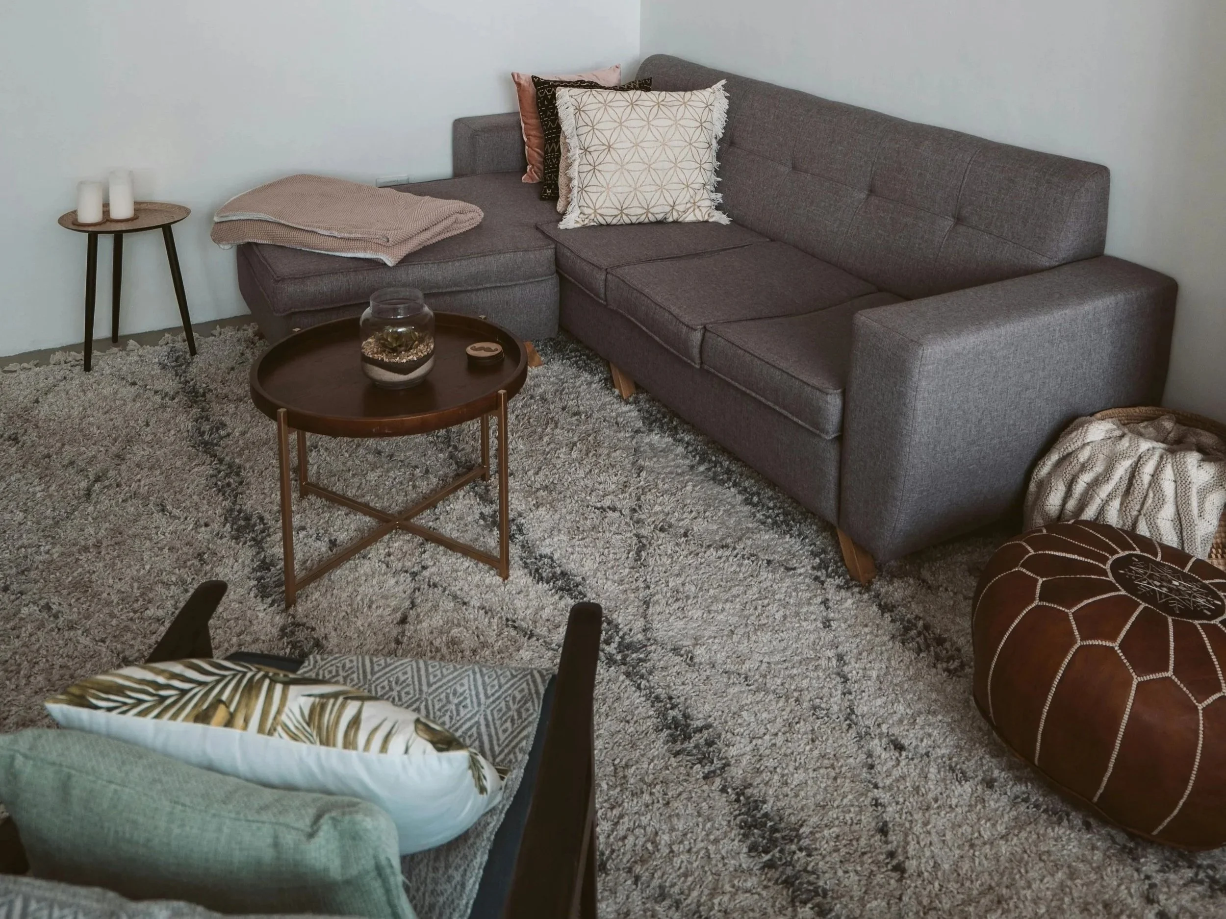 therapy room with grey sofa and coffee table