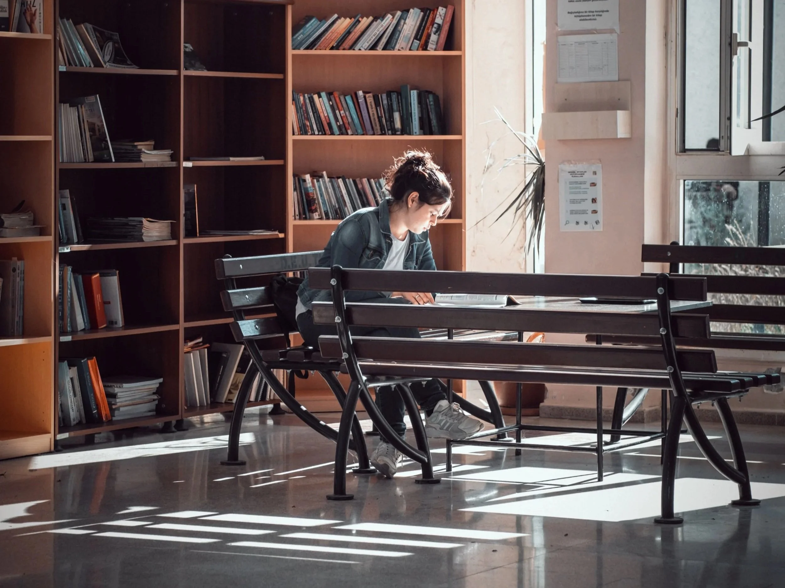 woman studying alone in college library