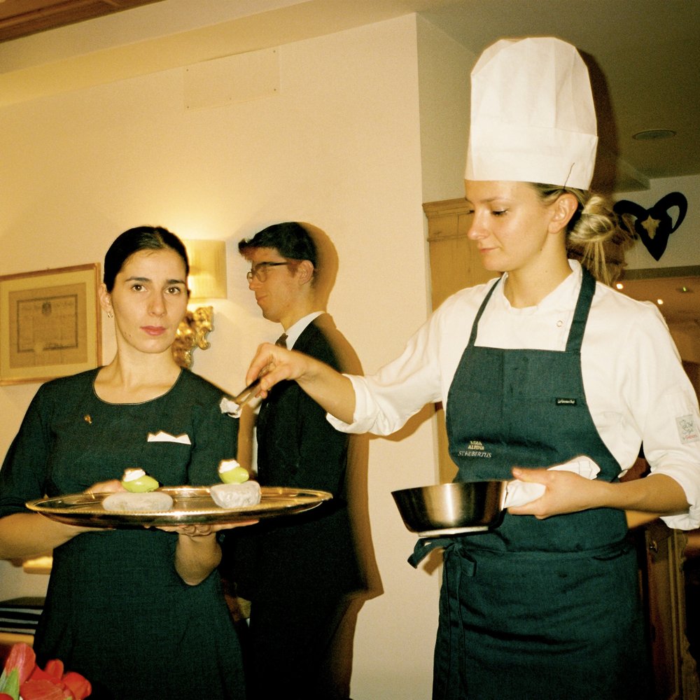 Dinner service at Alpina Rosa's 3 Star St. Hubertus restaurant