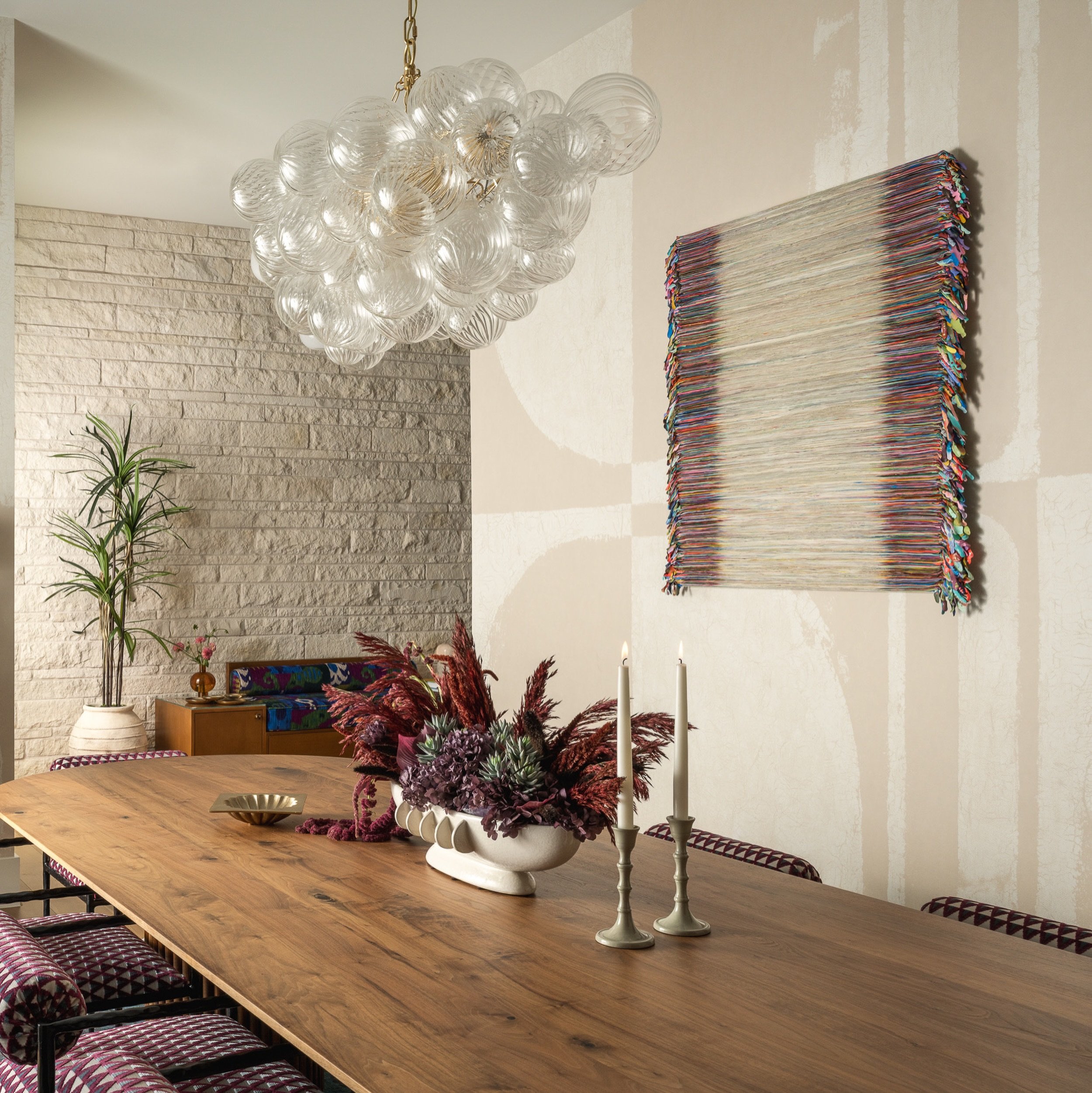 Art can extend the material language of a room onto the walls.

In the dining room, Monica Delgado&rsquo;s 10 Days Miami brings movement and physicality to a space already rich with color and material. Delgado works with acrylic almost sculpturally, 