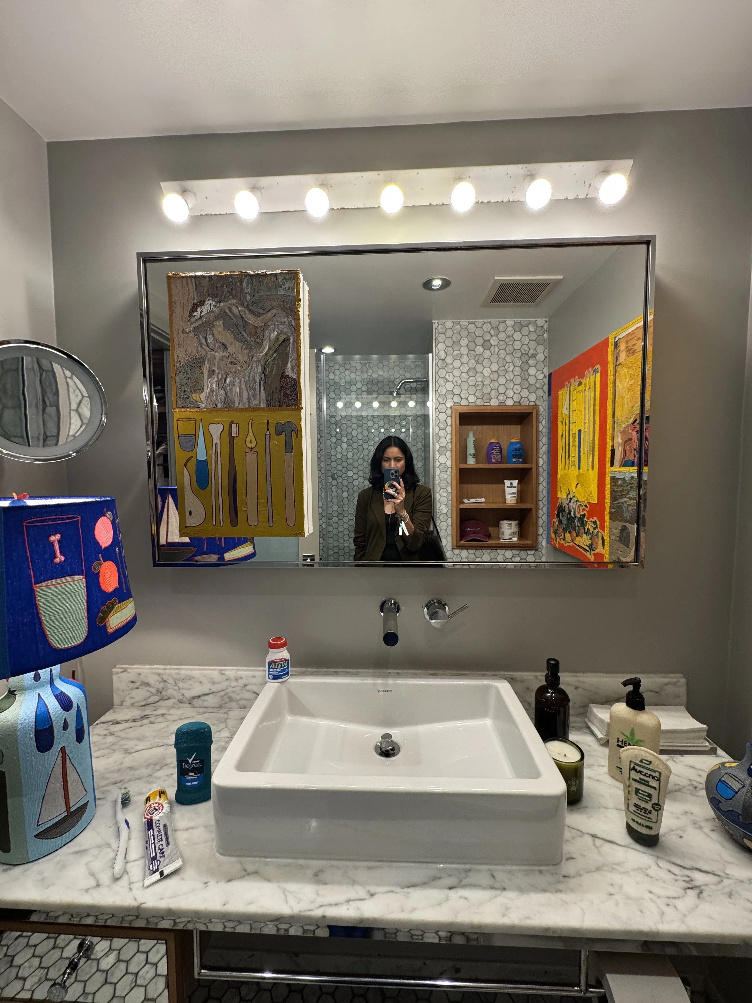 Felix Art Fair booth installation by Charles Hickey at Feia, with art and   objects arranged throughout a Roosevelt Hotel room setting