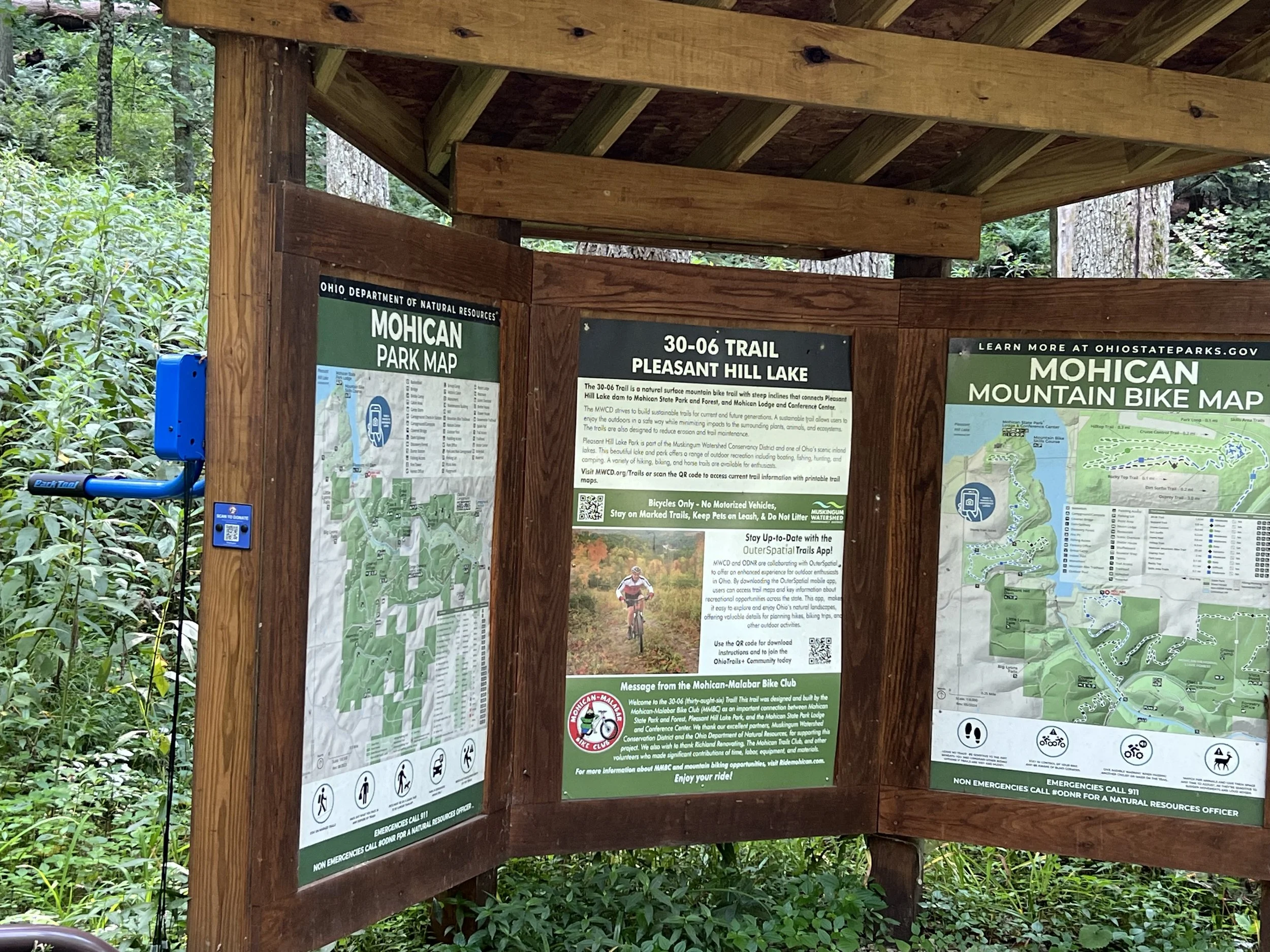 Repair stand and trail map at trail entrance