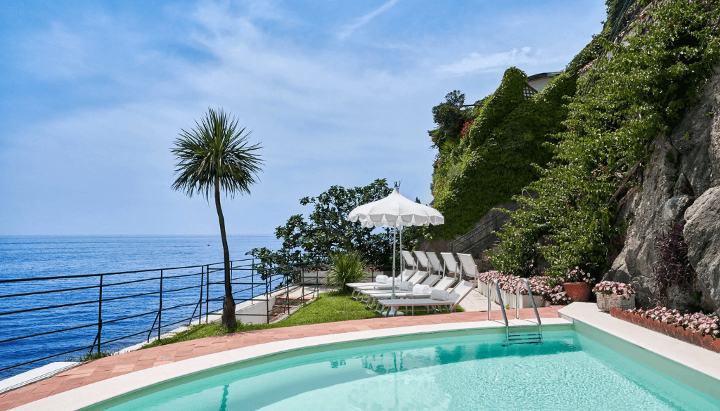 Palazzo Avino beach club pool in Ravello Italy overlooking the Amalfi Coast with turquoise sea and cliffside views