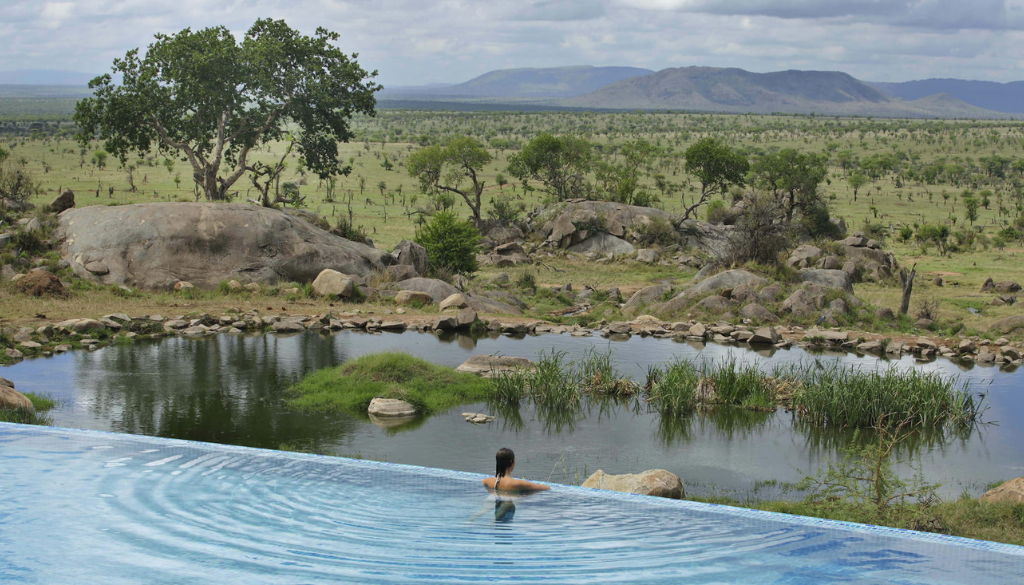 Luxury suite terrace at Four Seasons Safari Lodge Serengeti with elevated views over the Tanzanian savanna and wildlife