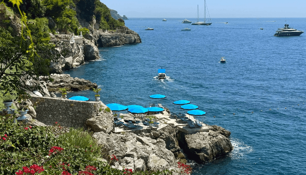 Private sea access beach at Villa Treville in Positano with stone steps leading to the Tyrrhenian Sea and luxury suites above