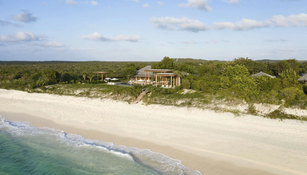 Luxury December honeymoon destinations — turquoise waters of Turks and Caicos, Northern Lights of Finnish Lapland, and private islands of the British Virgin Islands