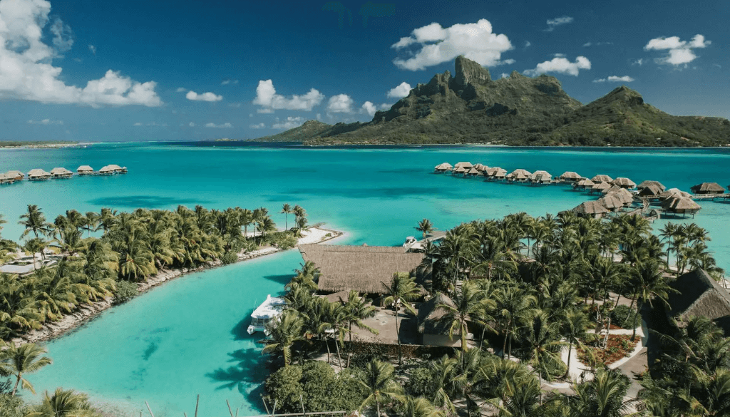 Four Seasons Resort Bora Bora with overwater bungalows and beachfront villas set against the emerald lagoon and Mount Otemanu French Polynesia