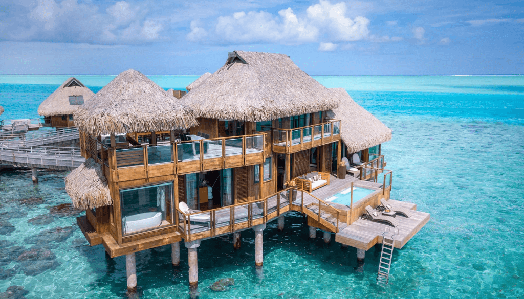 Presidential villa at Conrad Bora Bora Nui with overwater infinity pool, teak sun deck, and panoramic views of the Bora Bora lagoon