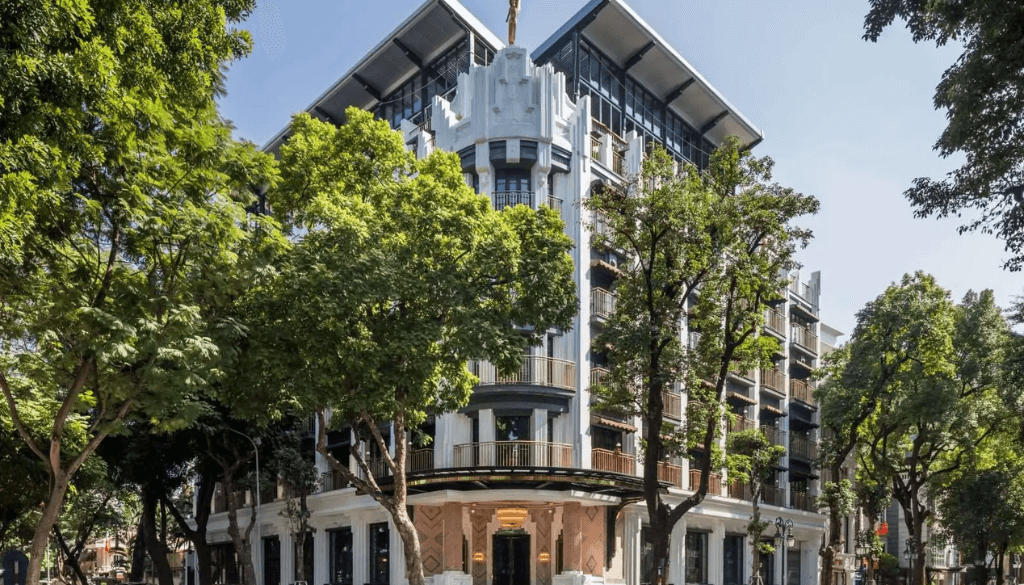 Art deco opera-inspired suite interior at Capella Hanoi hotel with grand furnishings, gold accents, and vintage glamour in the heart of Hanoi Vietnam