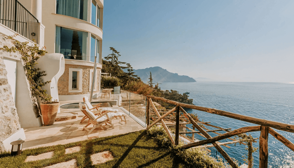 Premium pool suite at Borgo Santandrea with private terrace and panoramic views over the Amalfi Coast Mediterranean sea