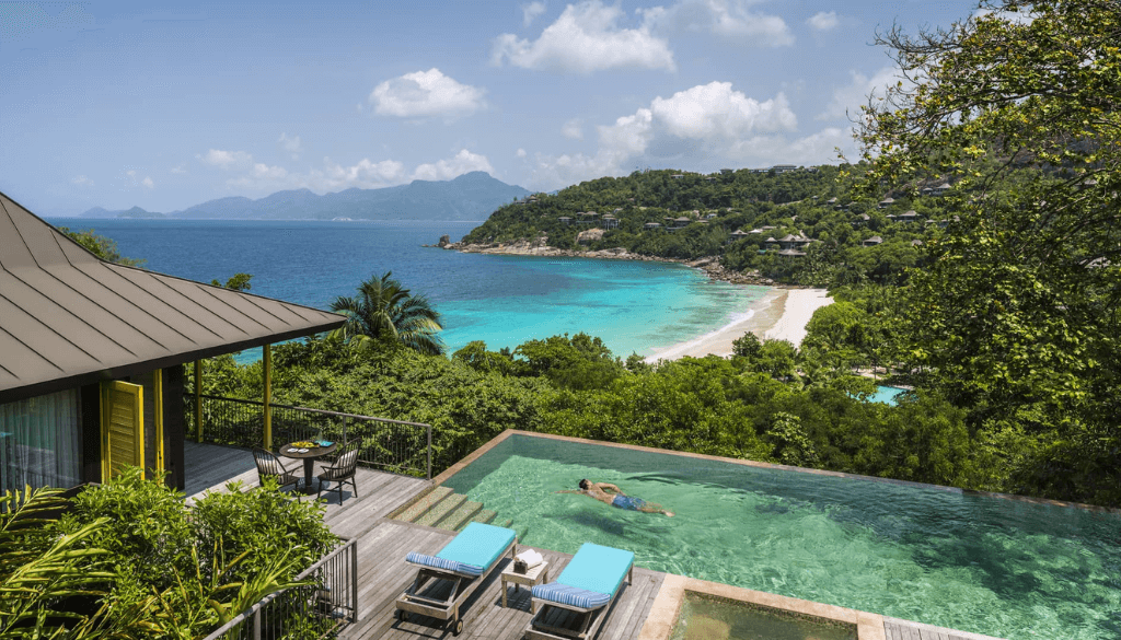 Four Seasons Resort Seychelles on Mahé island with hillside villa nestled in tropical jungle overlooking Petite Anse Bay and the Indian Ocean