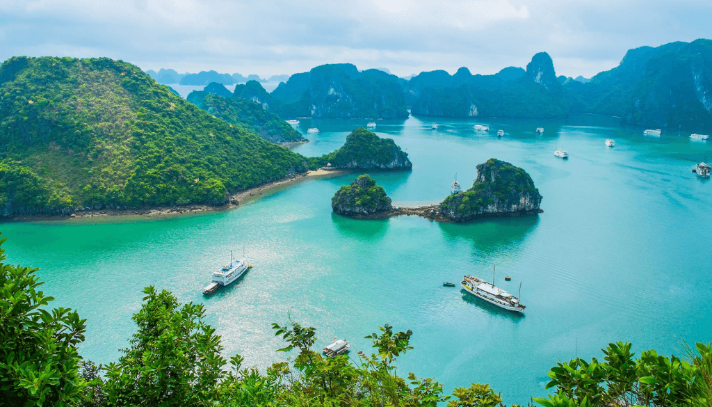 Ha Long Bay limestone karsts rising from emerald waters on a luxury overnight cruise in Vietnam — honeymoon experience November