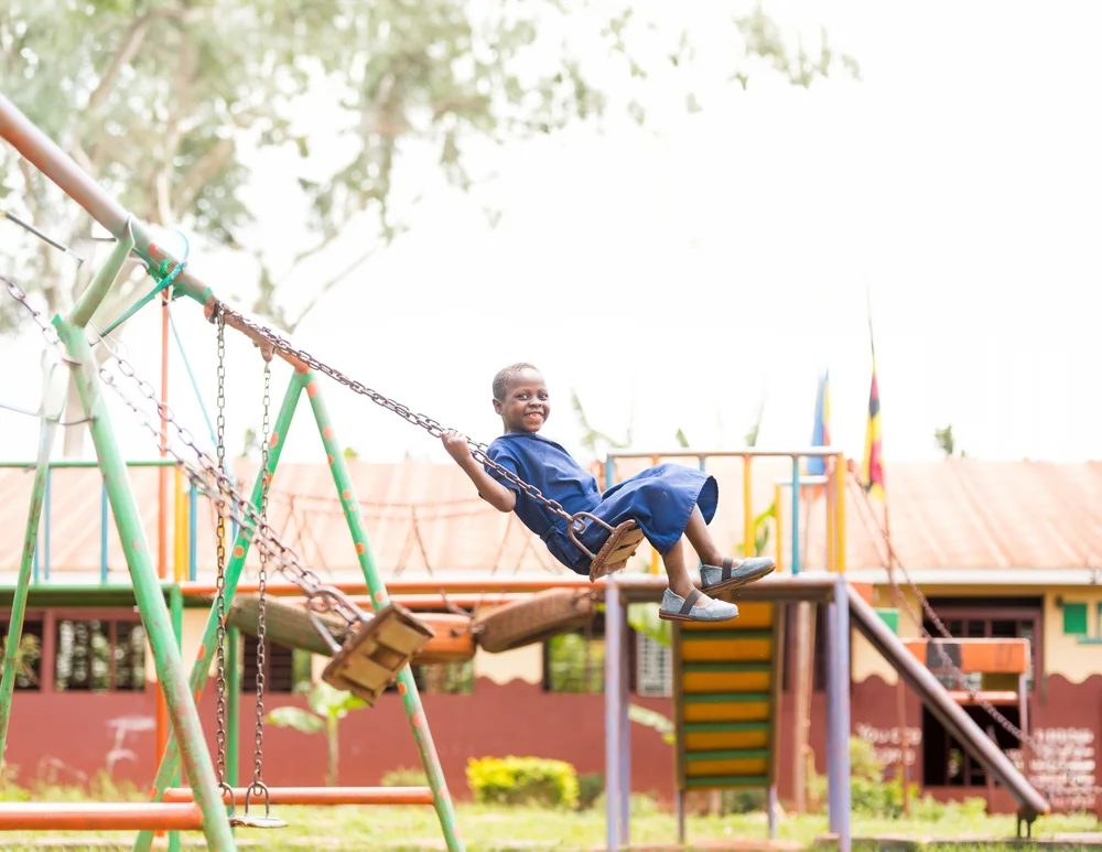 Ruth soaring on a swing after jigger treatment at Sole Hope