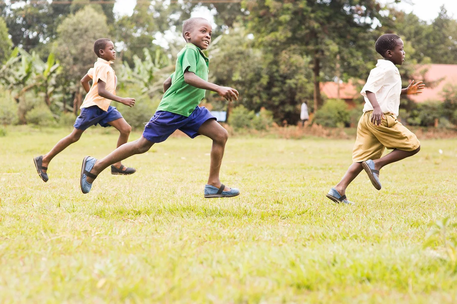 Children running free in Sole Hope shoes