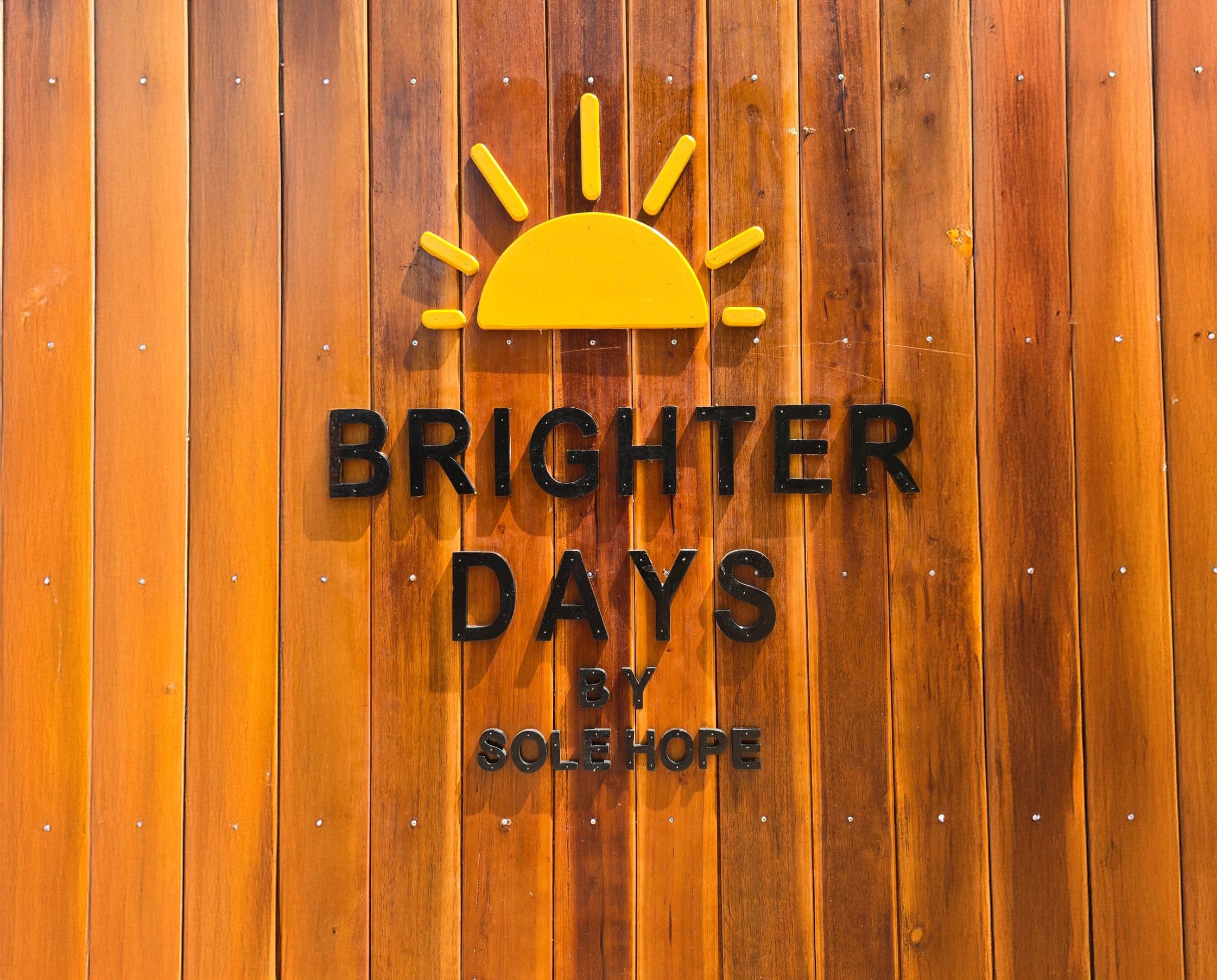 Brighter Days Sign on fence