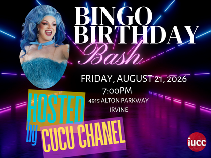 Drag Queen Cucu Chanel with long wavy blue hair and a blue feathery dress amidst light lasers
