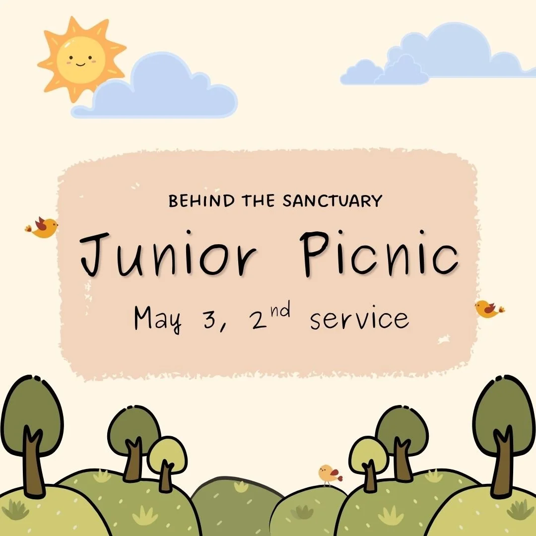 An illustrated smiling sun with green rolling hills and trees