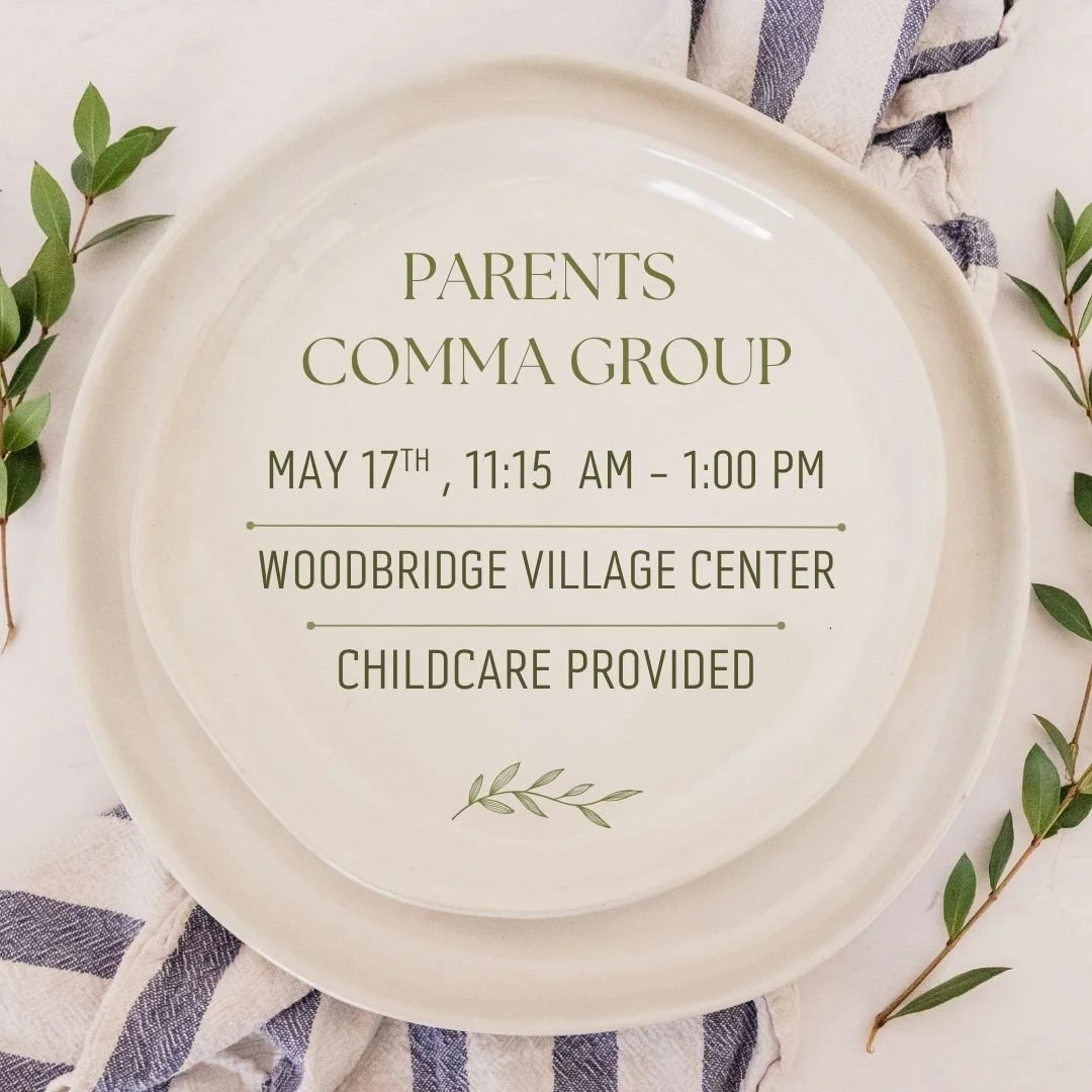 Cream colored plates with greenery and a hand towel surrounding