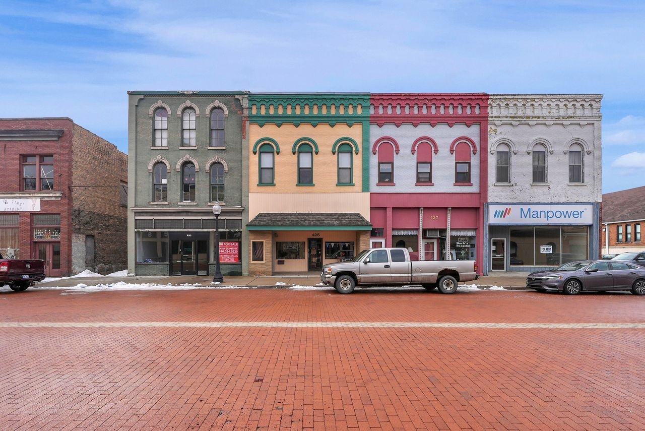 Antique Stores to the right, and an available space where Manpower was.