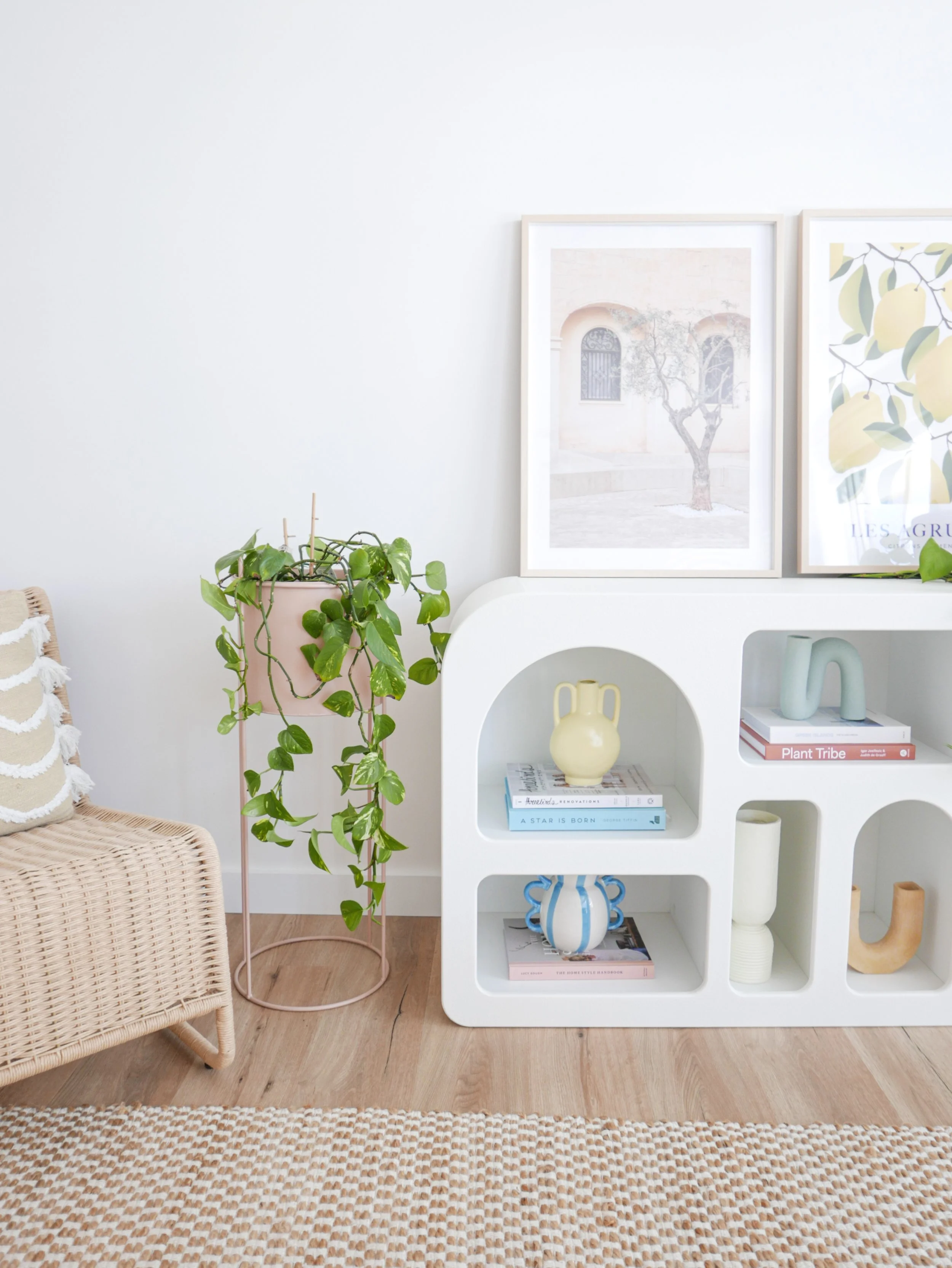white-arched-bookshelf-styled-ceramics-books-pothos-plant-interior-styling.jpg